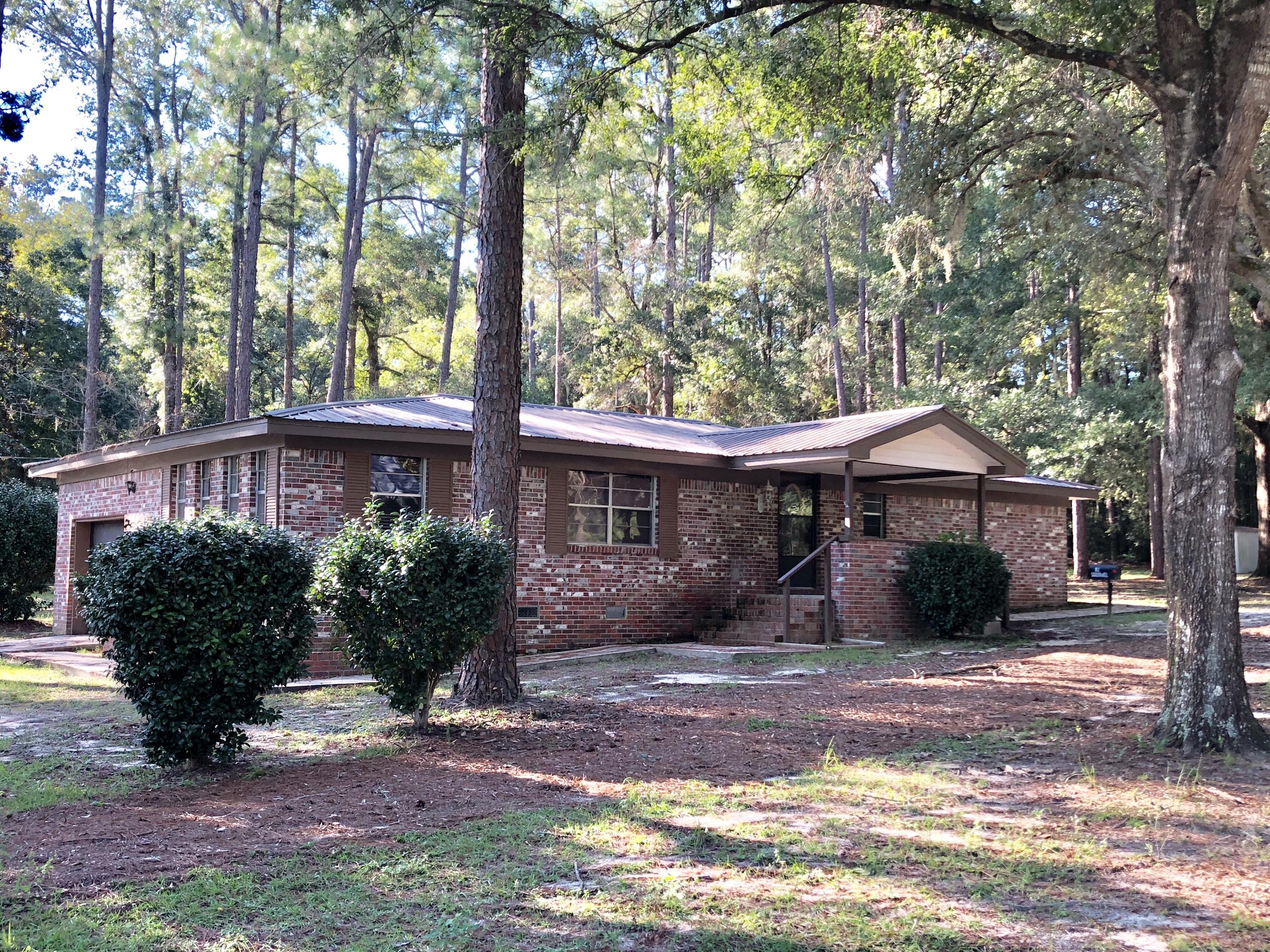 92 Squirrel Road DeFuniak Springs, FL 32433 - Photo 1 of 2 a front view of a house with garden