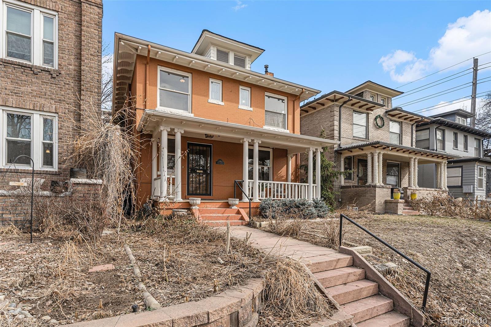 1314 Vine Street Denver, CO 80206 - Photo 2 of 34 a front view of a house with a yard