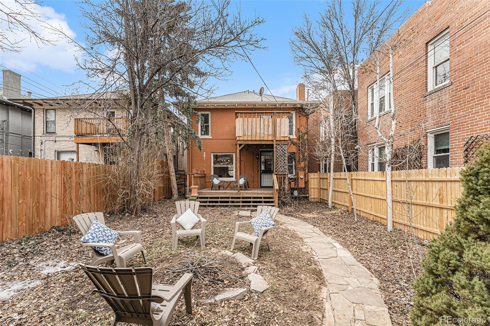 1314 Vine Street Denver, CO 80206 - Photo 29 of 34 a view of a house with a chairs in a patio