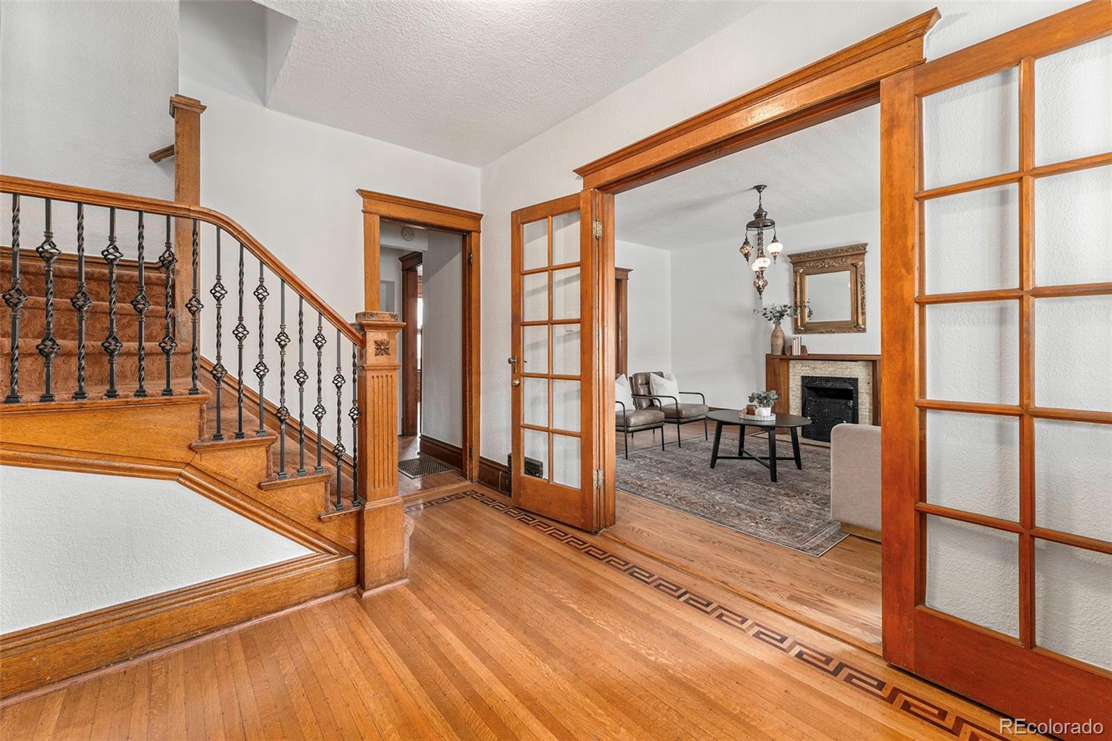 1314 Vine Street Denver, CO 80206 - Photo 3 of 34 a view of staircase with a rug and a window