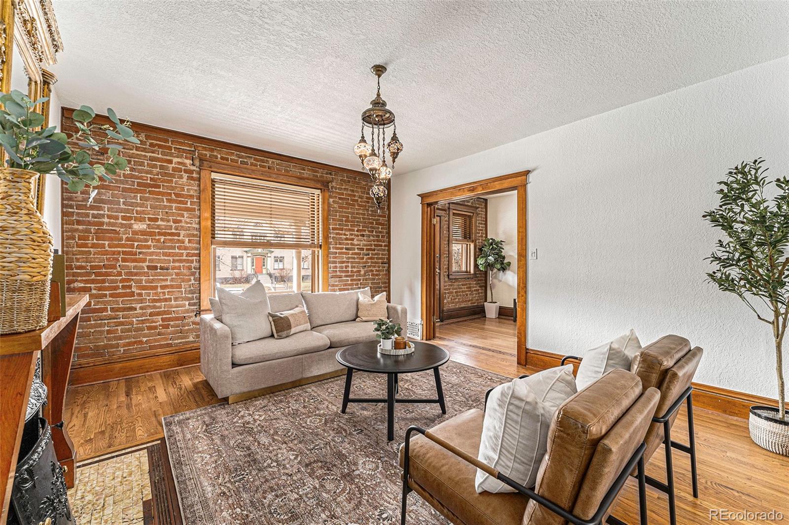 1314 Vine Street Denver, CO 80206 - Photo 6 of 34 a living room with furniture and a large window