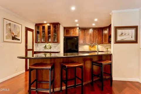 a kitchen with a table and chairs in it