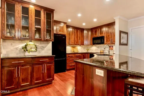 a kitchen with a sink stove and refrigerator