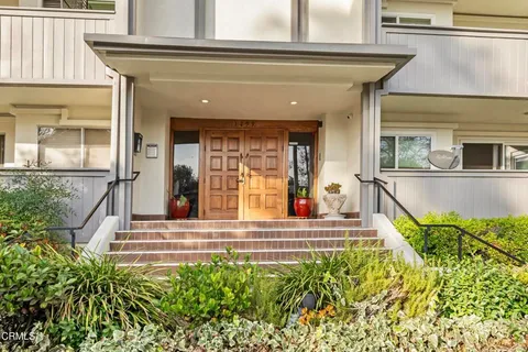 front view of a house with a small yard