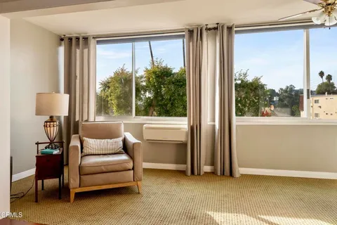 a living room with furniture and a window