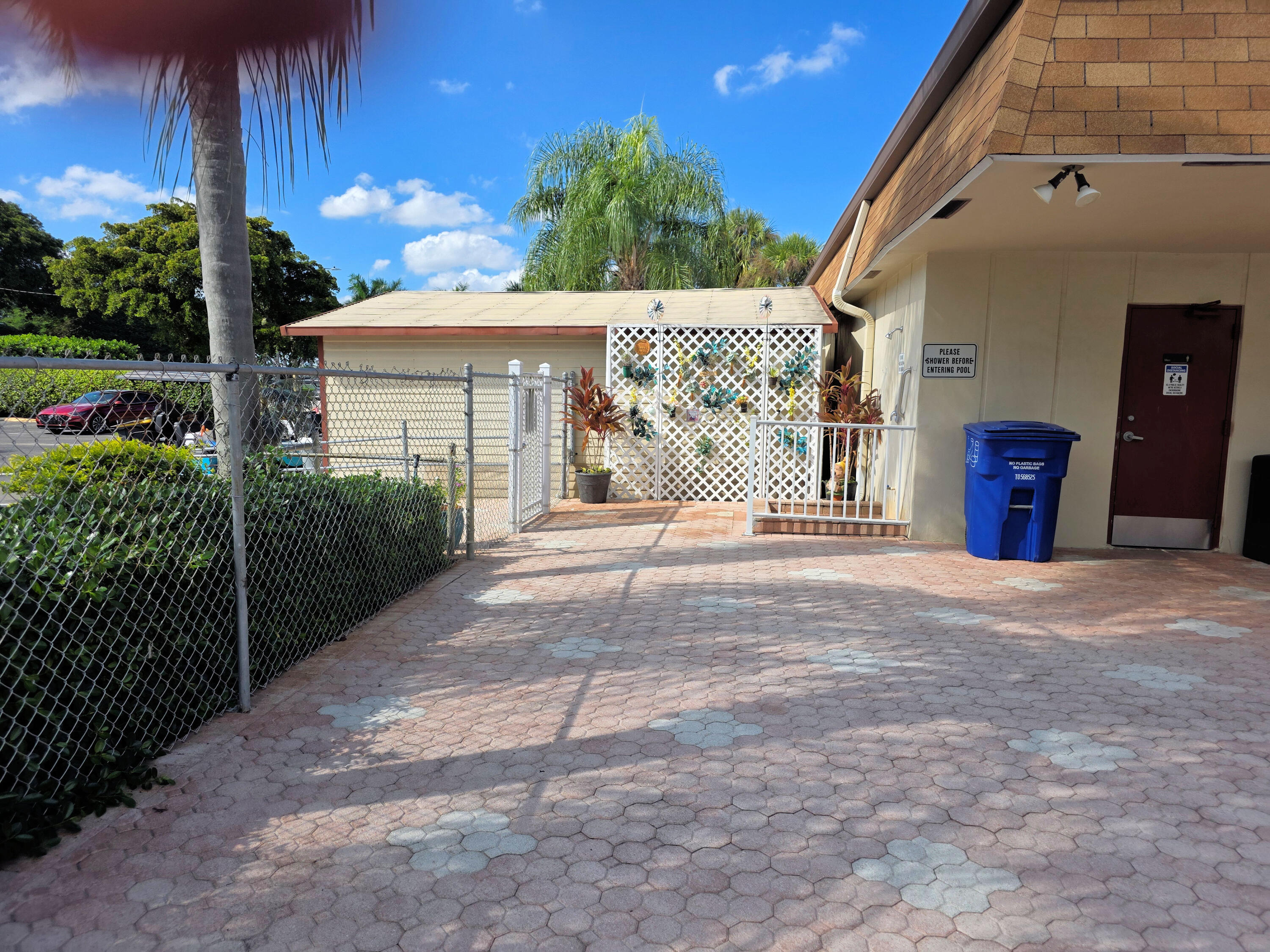 3 Abbey Lane, Unit 103 Delray Beach, FL 33446 - Photo 26 of 31 Outdoor pool area