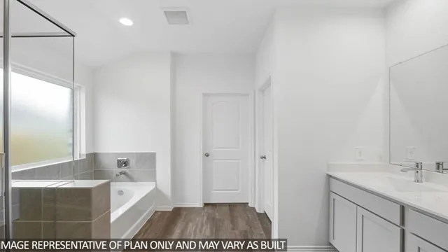 a bathroom with a sink a mirror and a bathtub