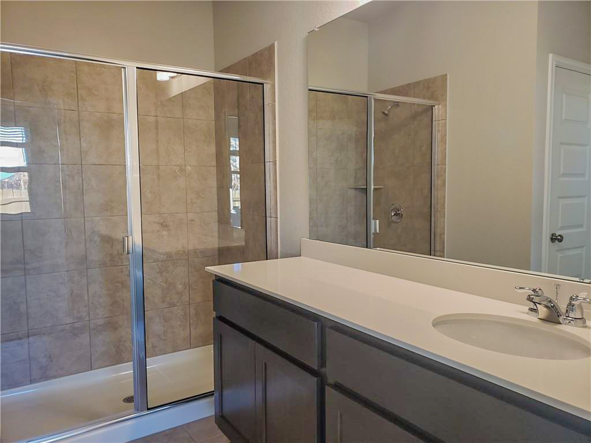 221 El Dorado Road Jarrell, TX 76537 - Photo 11 of 17 Full bath featuring vanity, a stall shower, and light tile patterned flooring