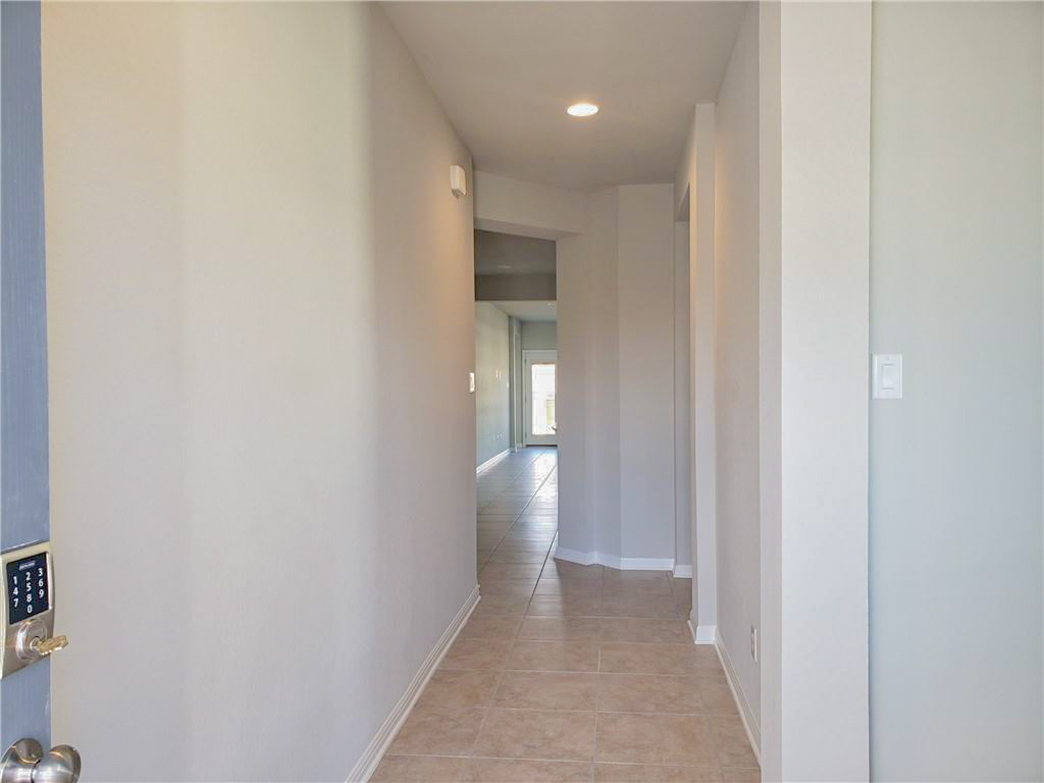 221 El Dorado Road Jarrell, TX 76537 - Photo 4 of 17 Corridor featuring light tile patterned floors and recessed lighting