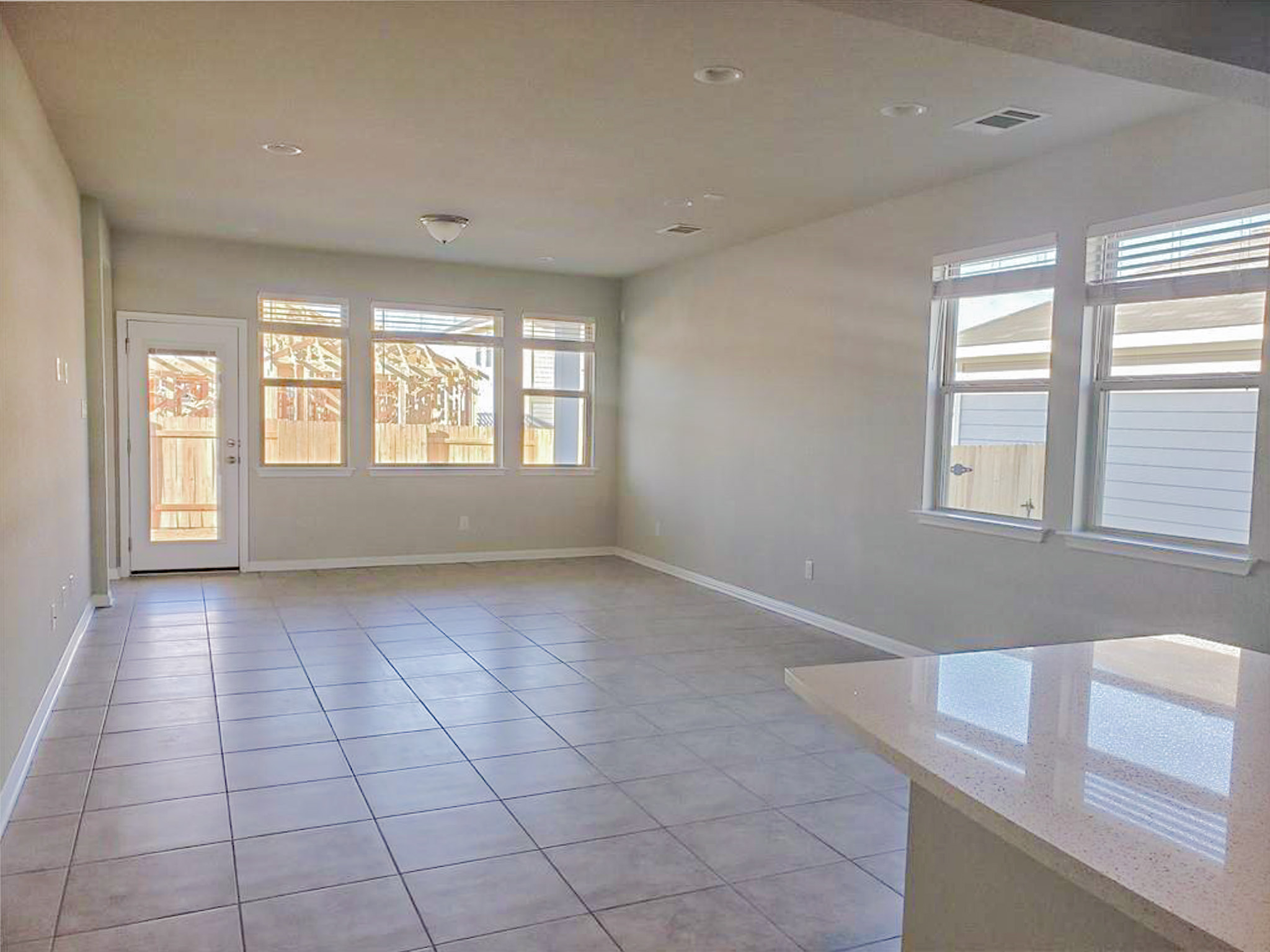 221 El Dorado Road Jarrell, TX 76537 - Photo 9 of 17 Empty room with light tile patterned flooring and recessed lighting