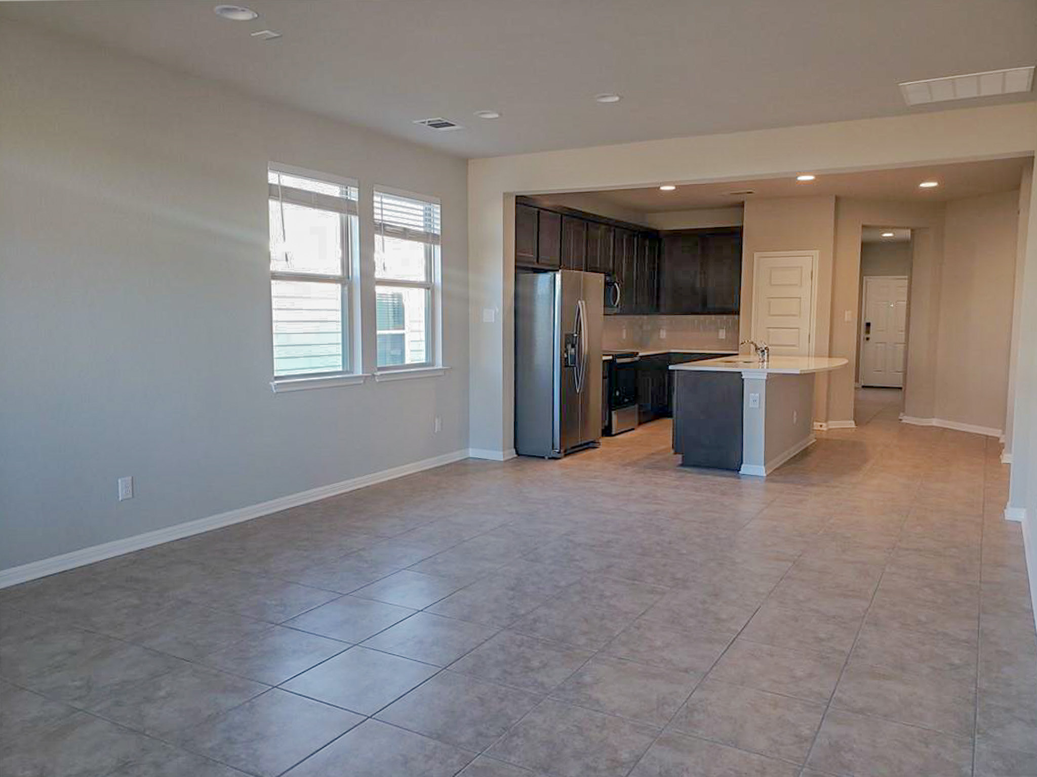 221 El Dorado Road Jarrell, TX 76537 - Photo 17 of 17 Kitchen featuring stainless steel appliances, open floor plan, recessed lighting, an island with sink, and tasteful backsplash