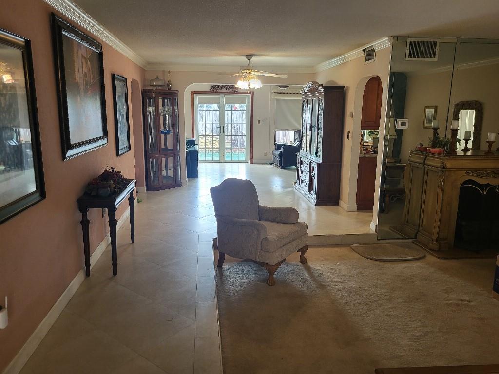10478 Northwest 4th Street Plantation, FL 33324 - Photo 6 of 15 a living room with furniture and a chandelier