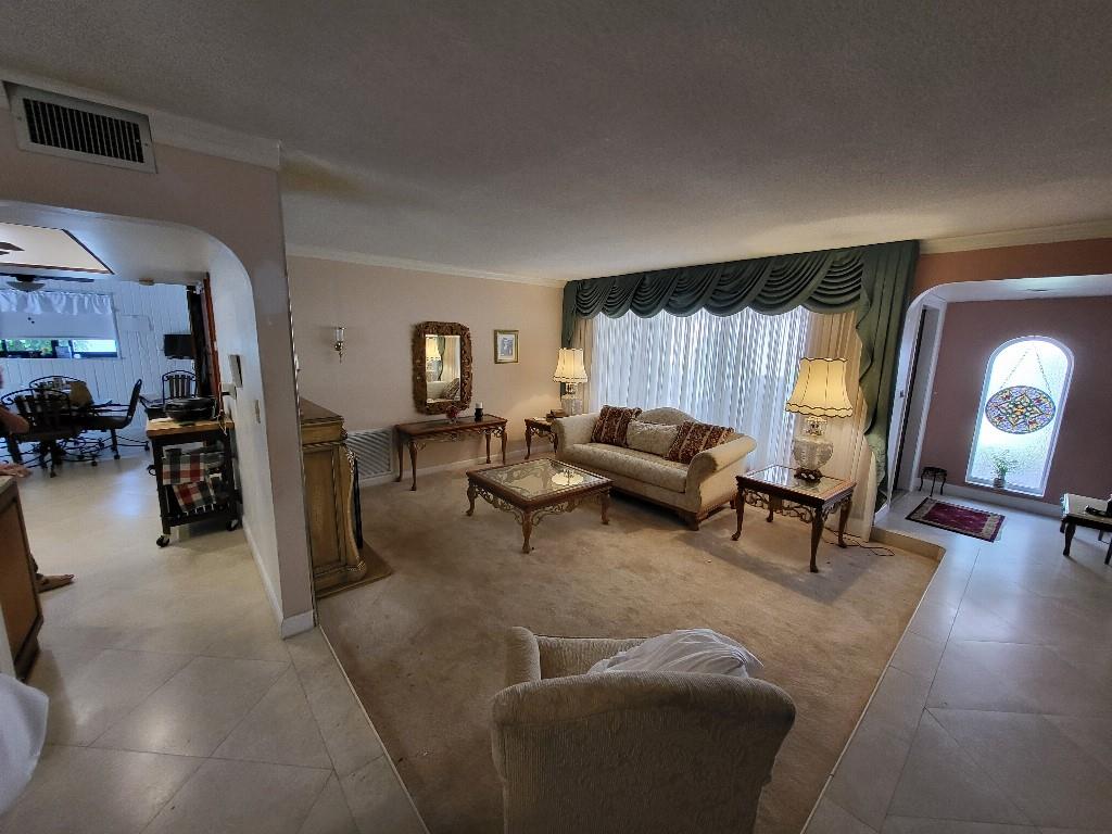 10478 Northwest 4th Street Plantation, FL 33324 - Photo 7 of 15 a living room with furniture and a lamp