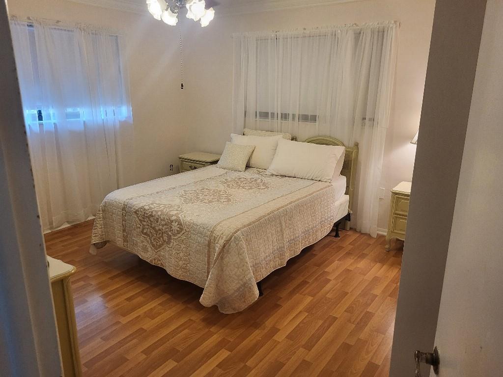 10478 Northwest 4th Street Plantation, FL 33324 - Photo 10 of 15 a bed sitting in a spacious bedroom next to a window