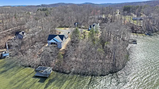 a aerial view of a house with a mountain