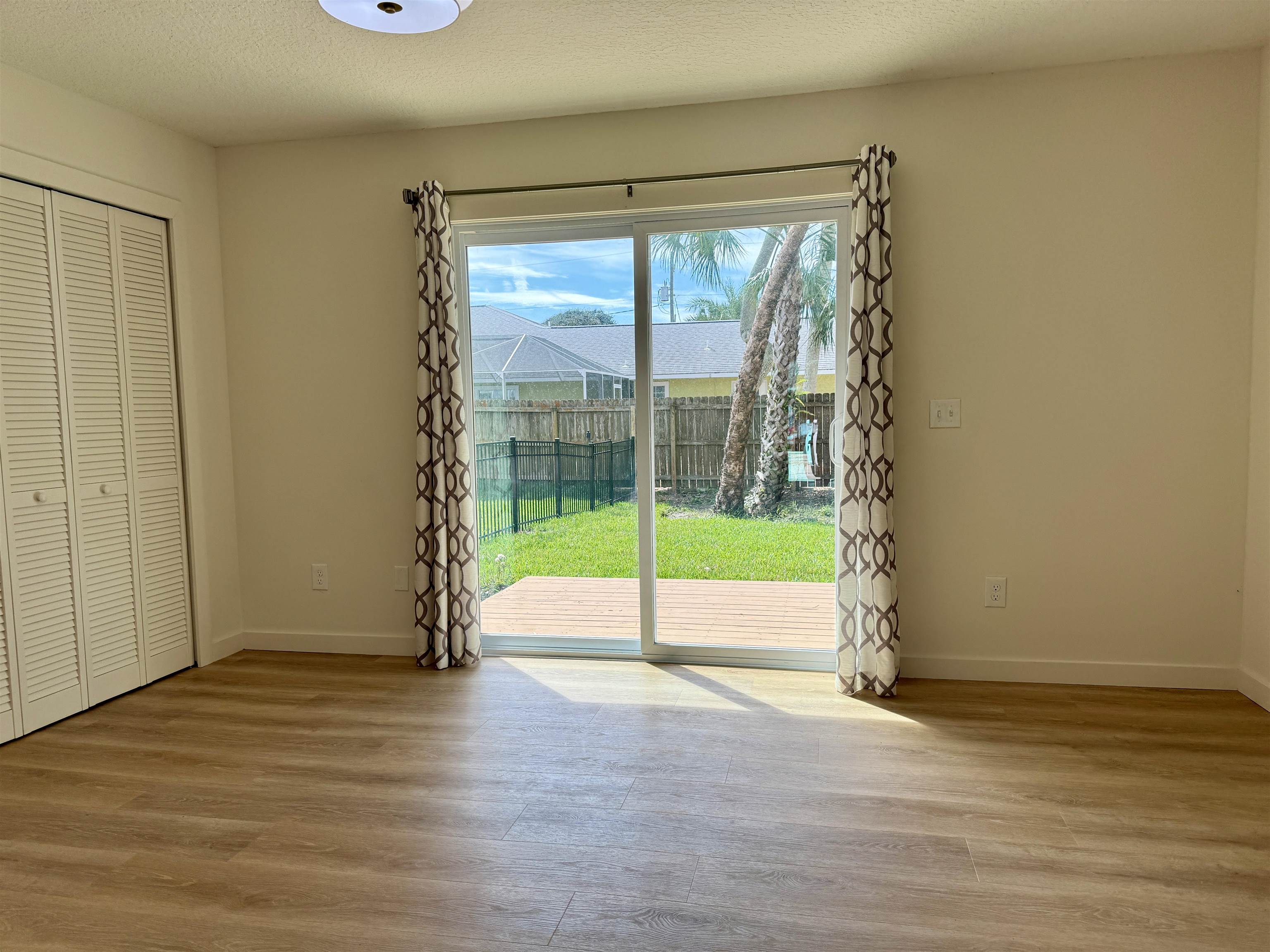 205 6th Street St. Augustine, FL 32080 - Photo 12 of 18 a view of an empty room and wooden floor