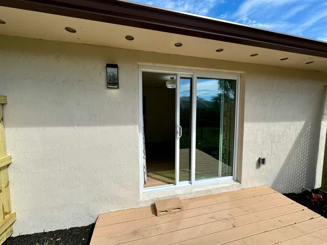a bathroom with a sink and a large window
