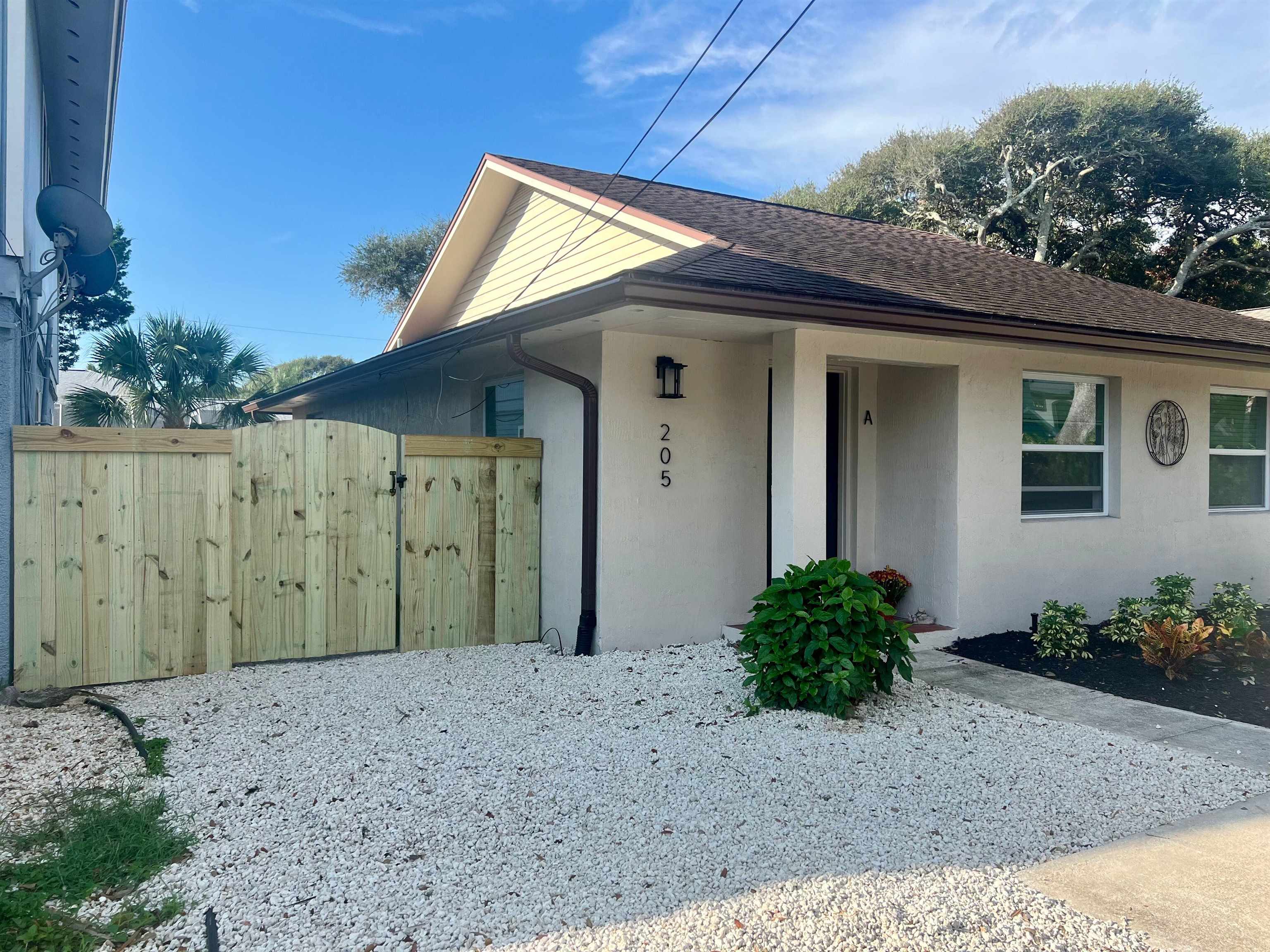 205 6th Street St. Augustine, FL 32080 - Photo 3 of 18 a view of a house with a backyard