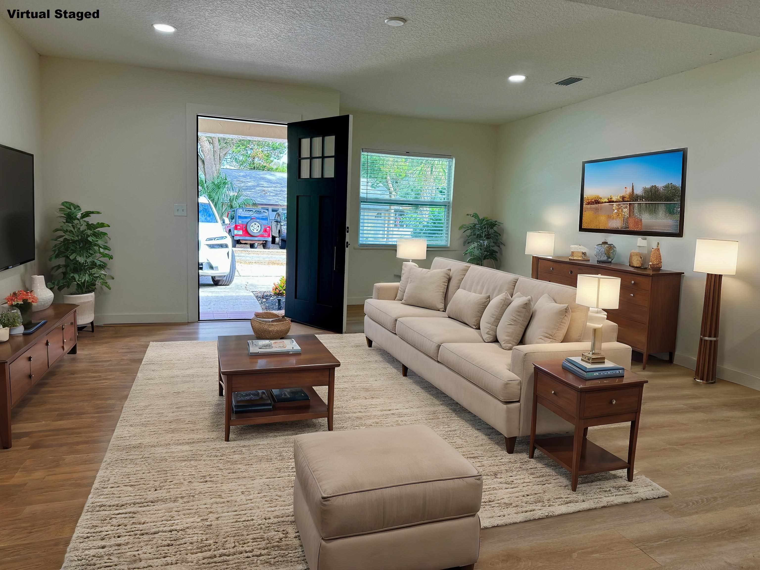 205 6th Street St. Augustine, FL 32080 - Photo 5 of 18 a living room with furniture and a flat screen tv