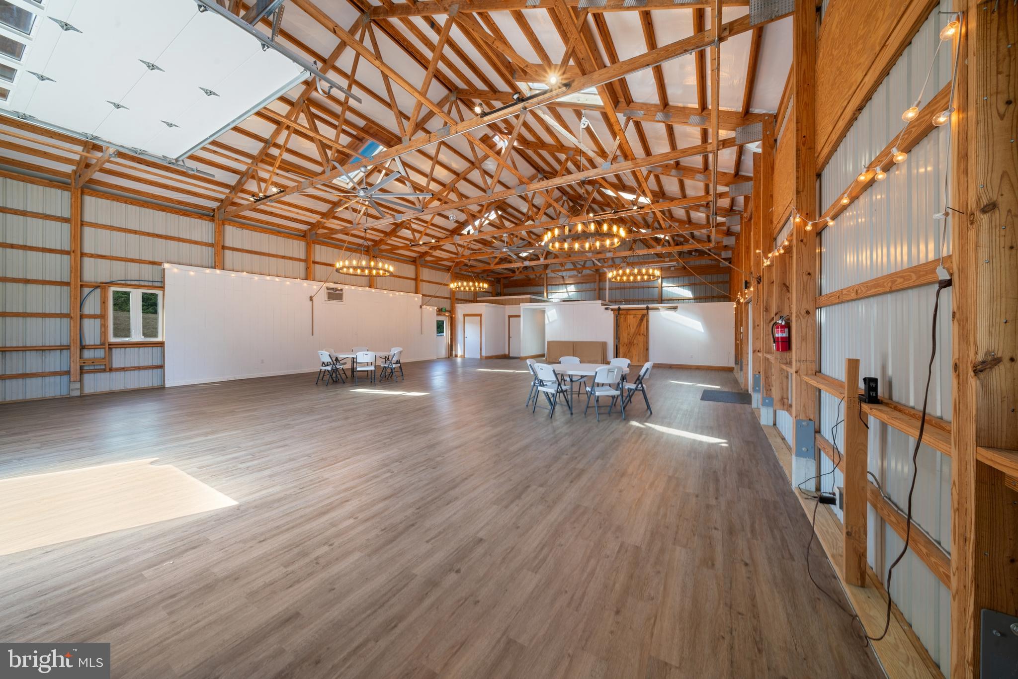 4040 Mills Road Sharpsburg, MD 21782 - Photo 87 of 127 Timber frame and wagon wheel lighting adds charm