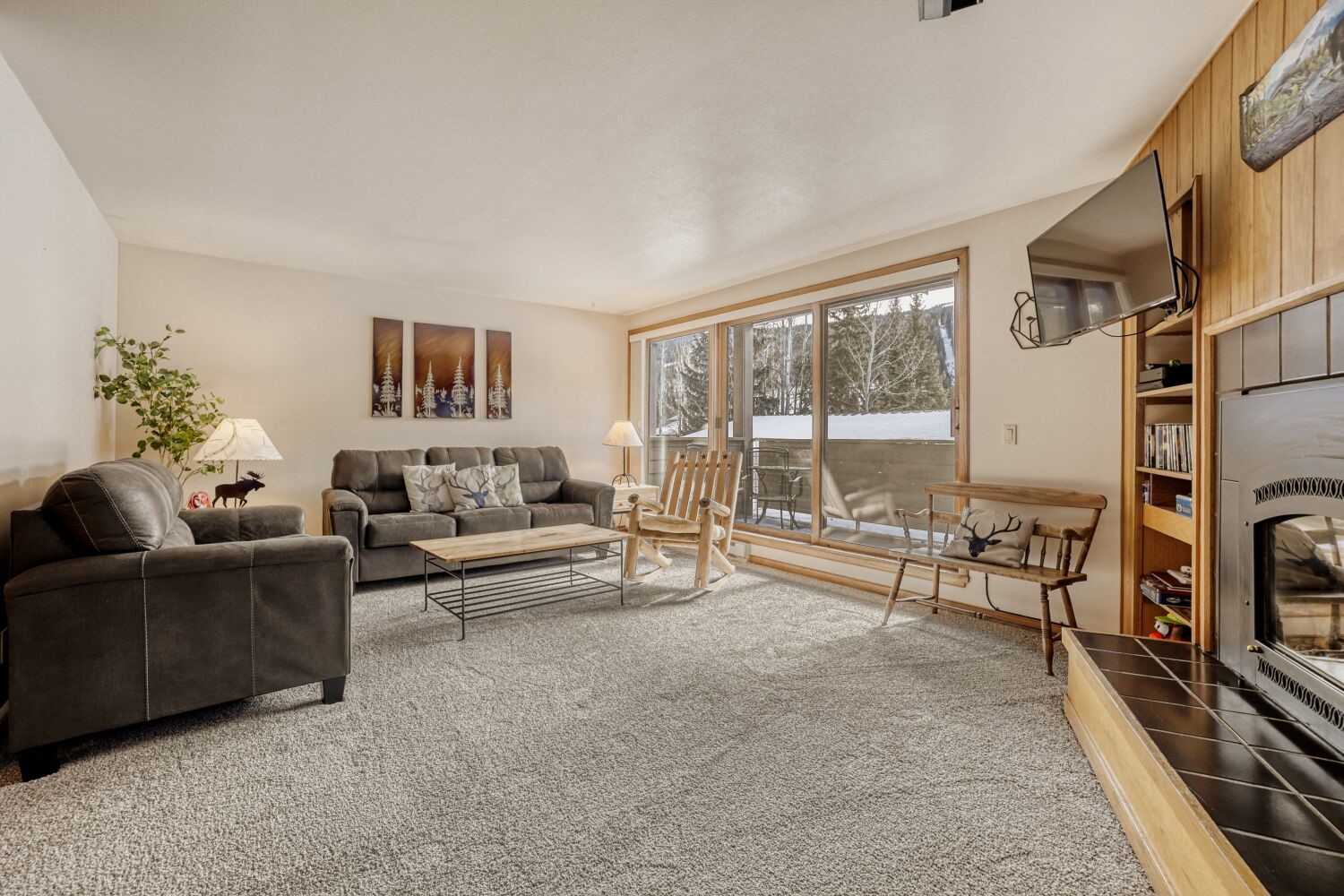 22804 Highway 6, Unit 108 Keystone, CO 80435 - Photo 2 of 28 Living area with a fireplace and carpet