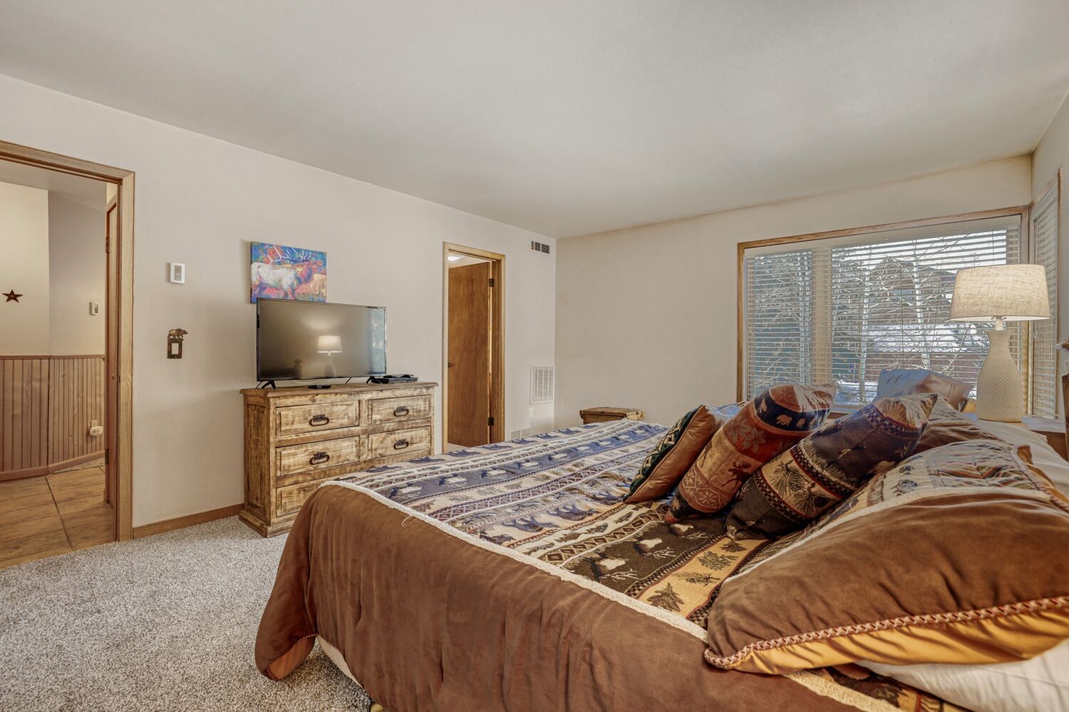 22804 Highway 6, Unit 108 Keystone, CO 80435 - Photo 24 of 28 Bedroom featuring light carpet and baseboards