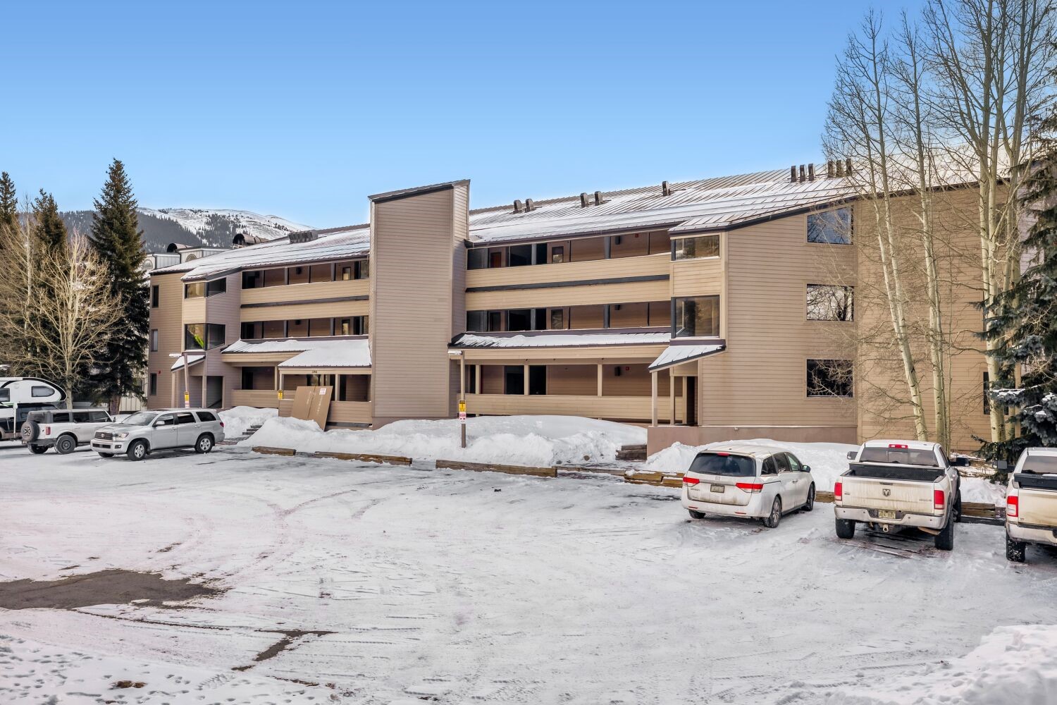 22804 Highway 6, Unit 108 Keystone, CO 80435 - Photo 28 of 28 Snow covered building featuring a view of apartment building / complex