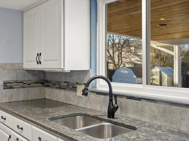 a kitchen with a sink and a window