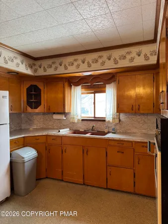 a room with a sink and a window