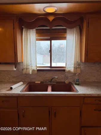 a kitchen with stainless steel appliances granite countertop a stove and a microwave