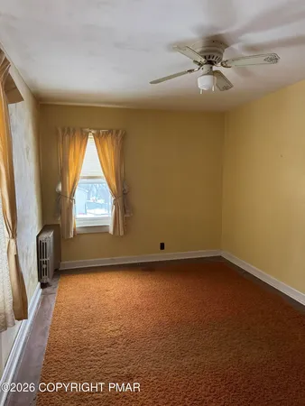 a view of empty room with windows