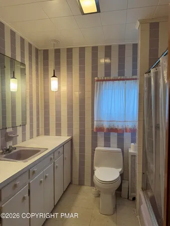 a view of a sink and cabinets