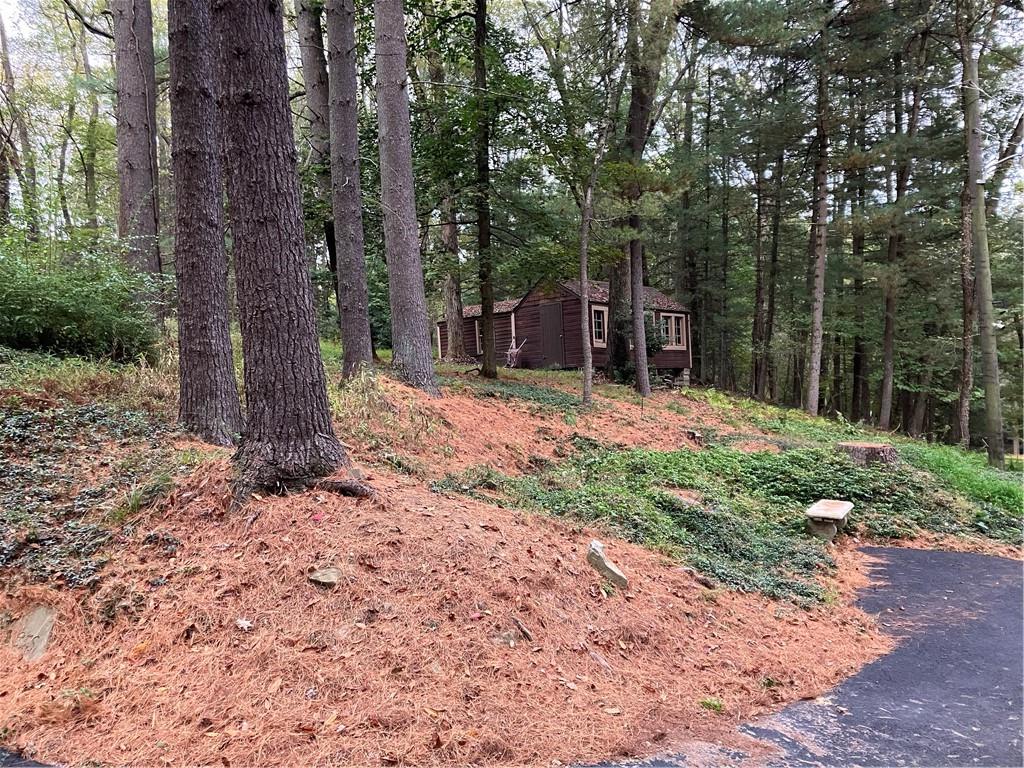 450 Old Plank Road Butler, PA 16002 - Photo 23 of 32 a wooden bench sitting in middle of forest