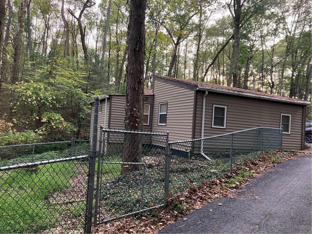 450 Old Plank Road Butler, PA 16002 - Photo 29 of 32 a backyard of a house with lots of green space