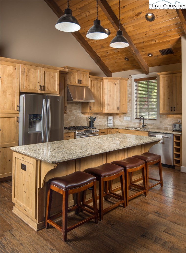 1253 Goldenrod Road Boone, NC 28607 - Photo 8 of 48 a kitchen with cabinets and wooden floor