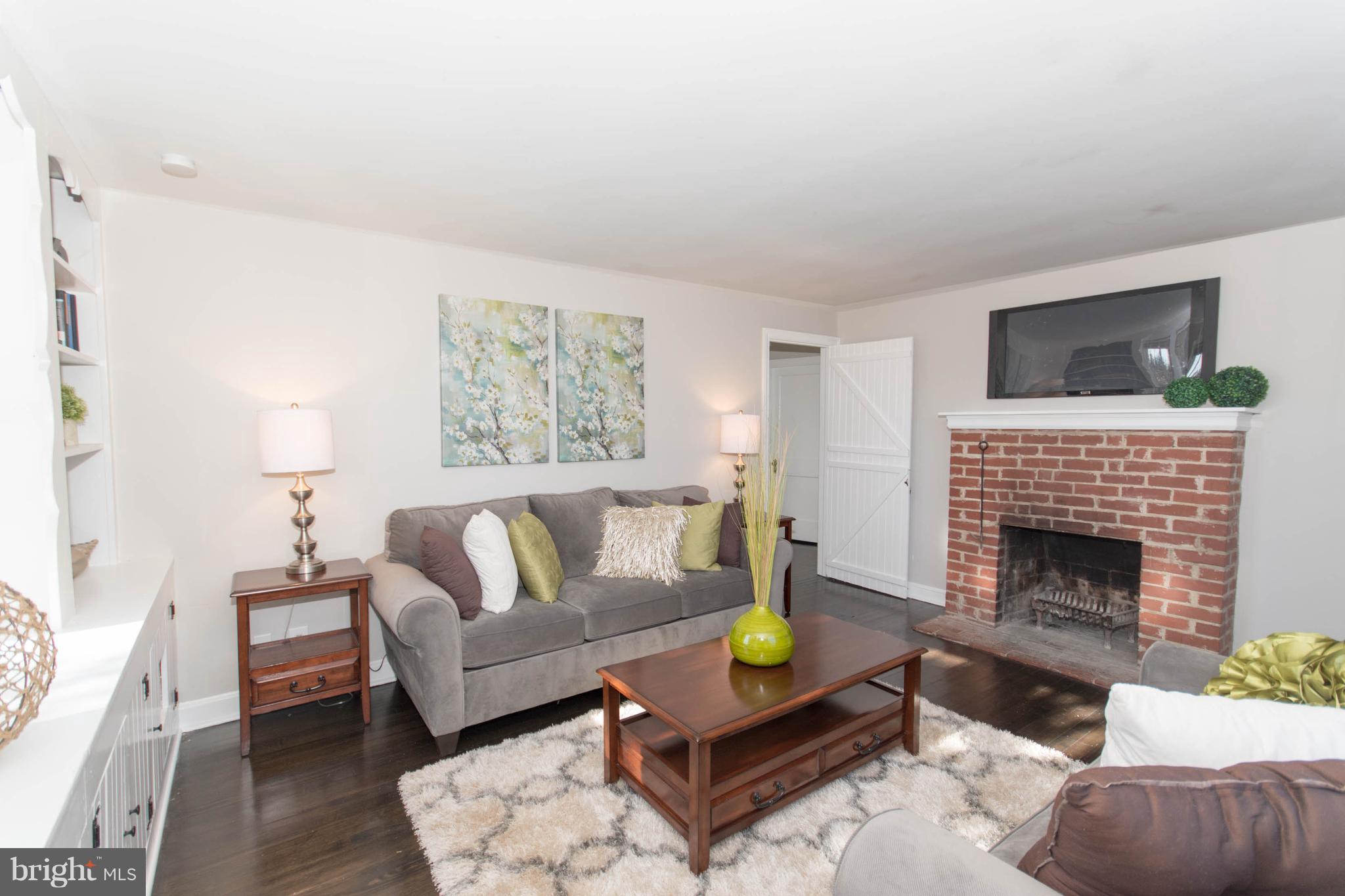 110 South Warminster Road Hatboro, PA 19040 - Photo 4 of 29 Living Room with wood burning fireplace
