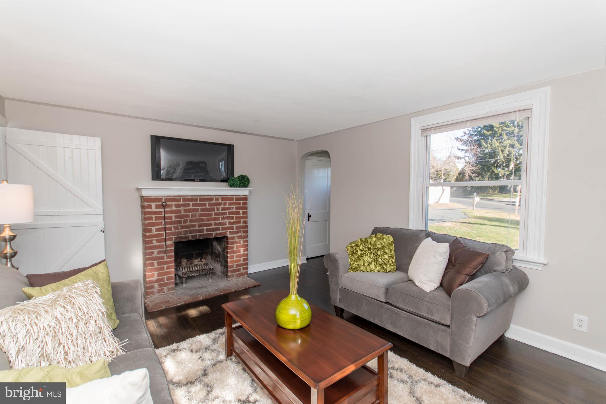 110 South Warminster Road Hatboro, PA 19040 - Photo 5 of 29 Living Room with wood burning fireplace