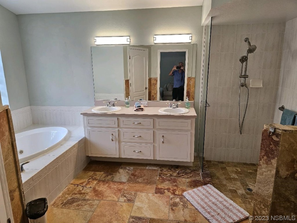 1308 South Riverside Drive Edgewater, FL 32132 - Photo 12 of 16 a bathroom with a sink a toilet and shower