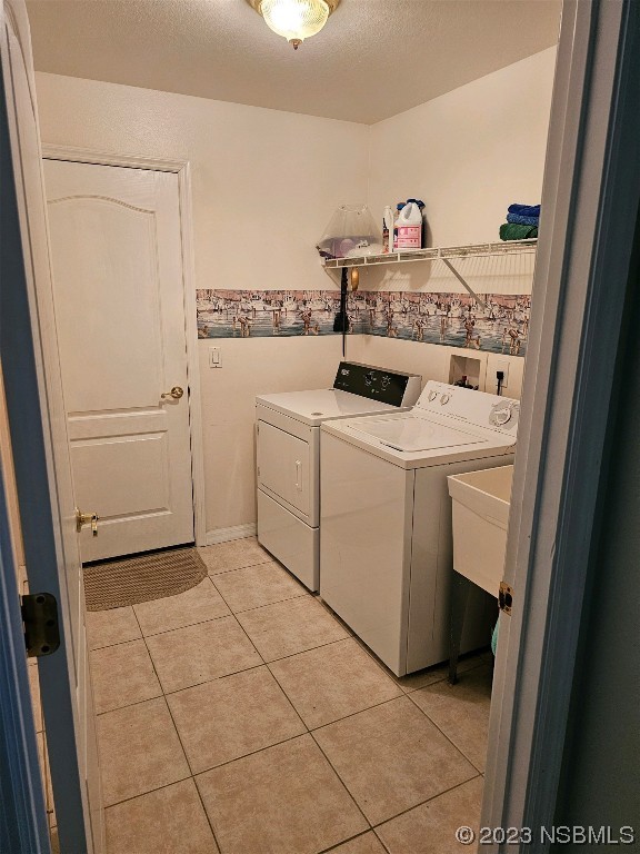 1308 South Riverside Drive Edgewater, FL 32132 - Photo 16 of 16 a utility room with dryer and washer