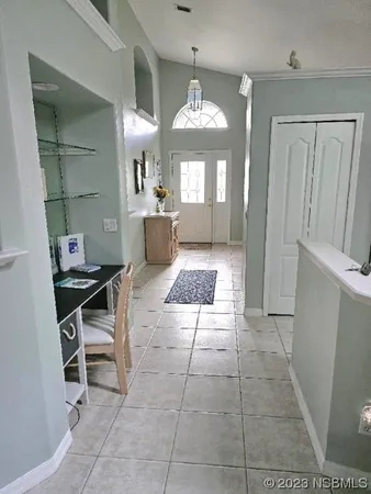 a large bathroom with a mirror and a bath tub