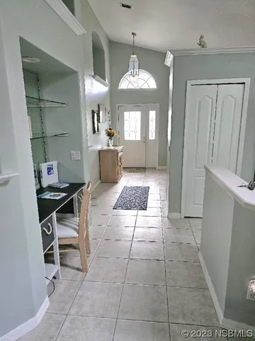 a large bathroom with a mirror and a bath tub