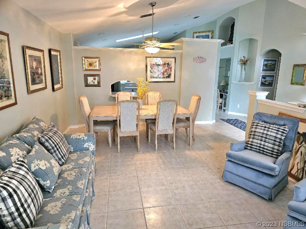 1308 South Riverside Drive Edgewater, FL 32132 - Photo 10 of 16 a living room with furniture and a window