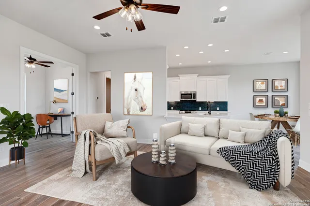 a living room with furniture or couch and a potted plant