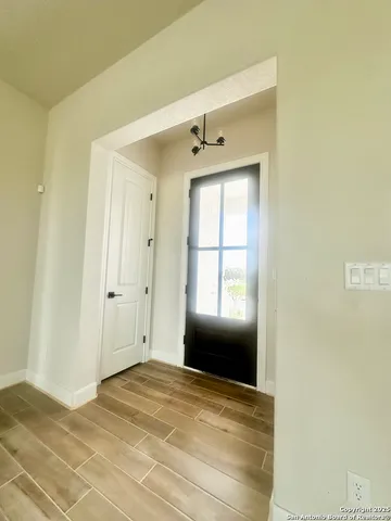 a view of empty room with windows