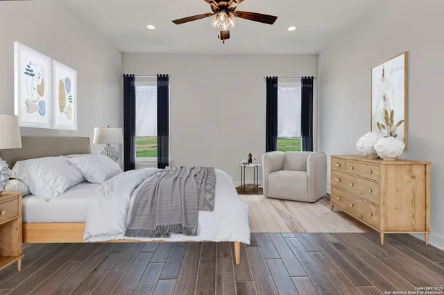 a bedroom with a bed and window