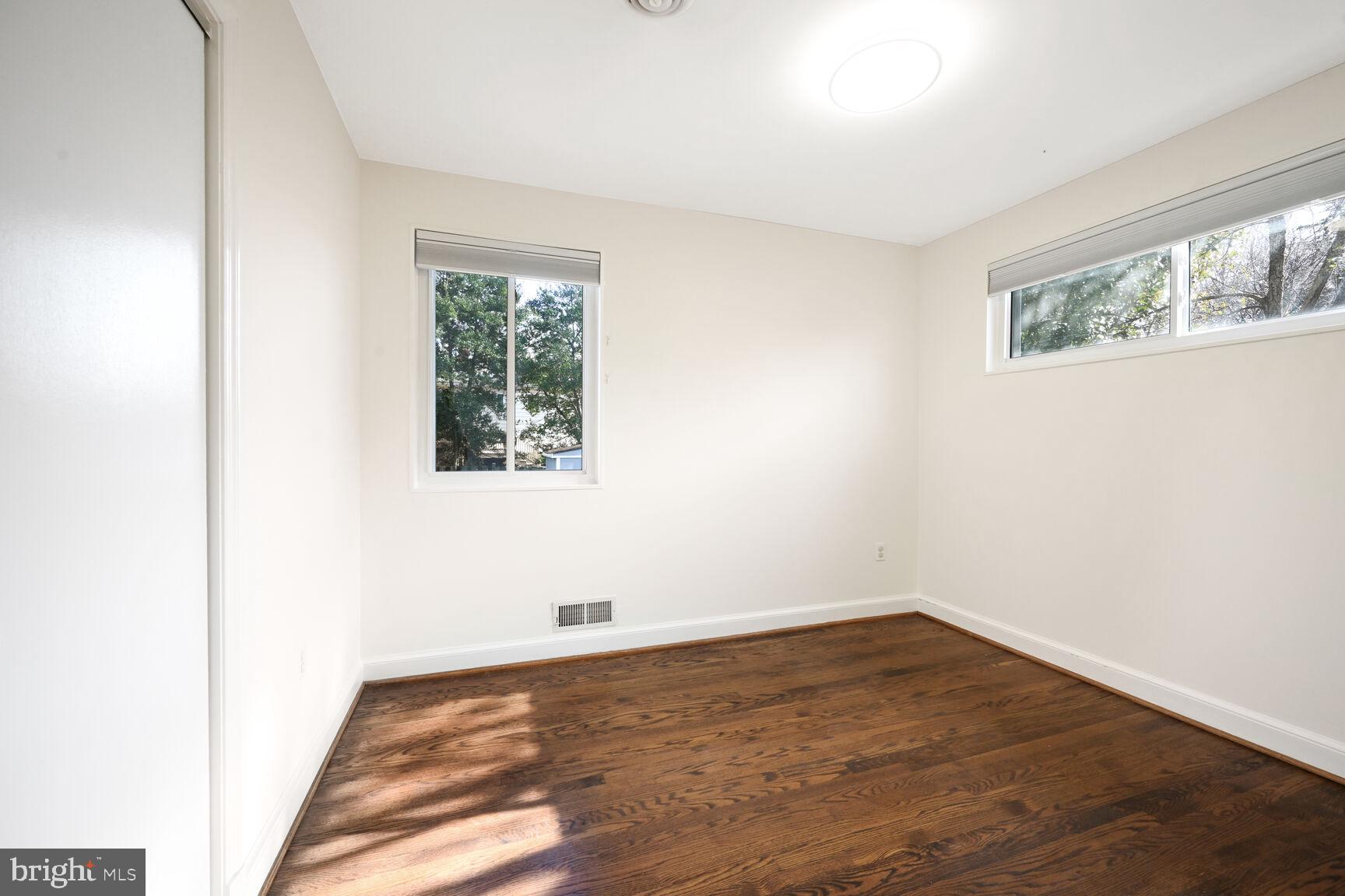 10117 Renfrew Road Silver Spring, MD 20901 - Photo 8 of 15 an empty room with a window