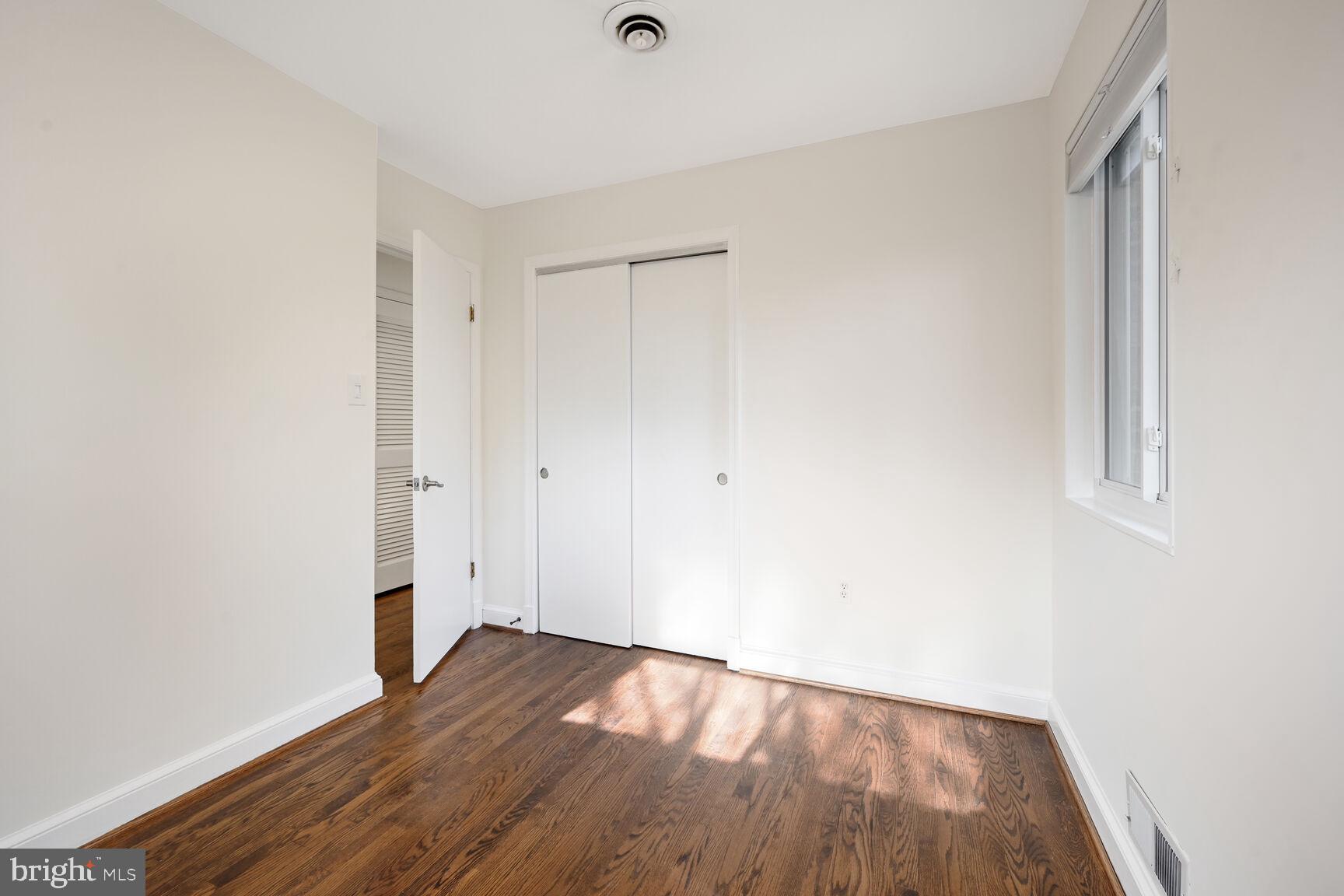10117 Renfrew Road Silver Spring, MD 20901 - Photo 9 of 15 a view of empty room with wooden floor
