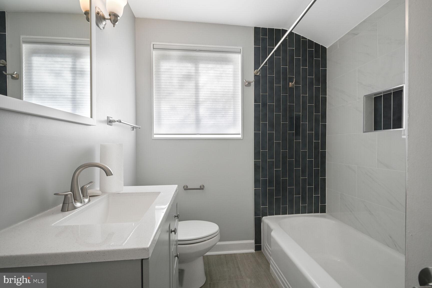 10117 Renfrew Road Silver Spring, MD 20901 - Photo 10 of 15 a bathroom with a sink toilet and shower