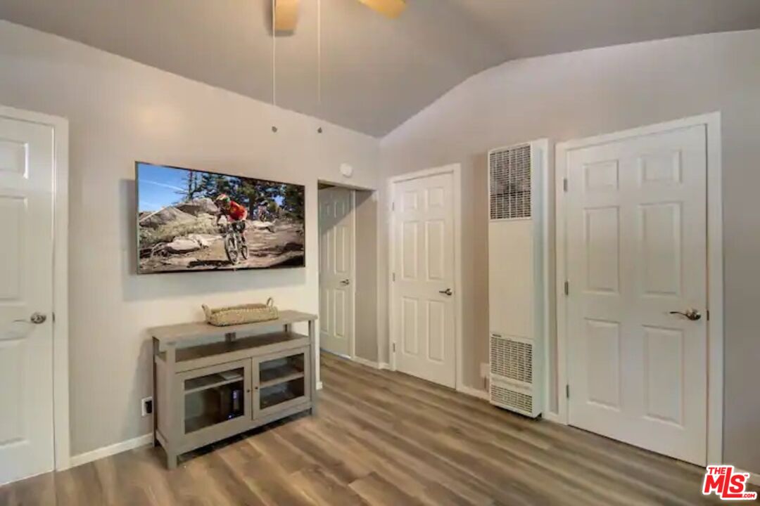39219 Cedar Dell Road Fawnskin, CA 92333 - Photo 20 of 23 a view of a livingroom with wooden floor