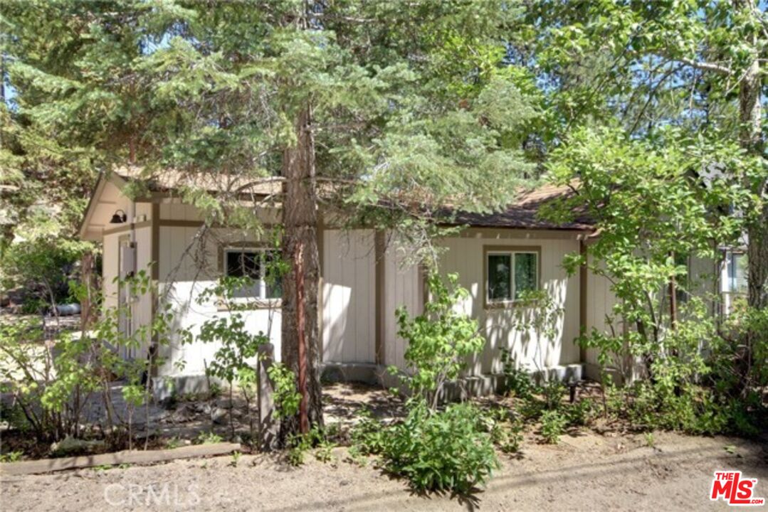 39219 Cedar Dell Road Fawnskin, CA 92333 - Photo 2 of 23 a front view of a house with a yard